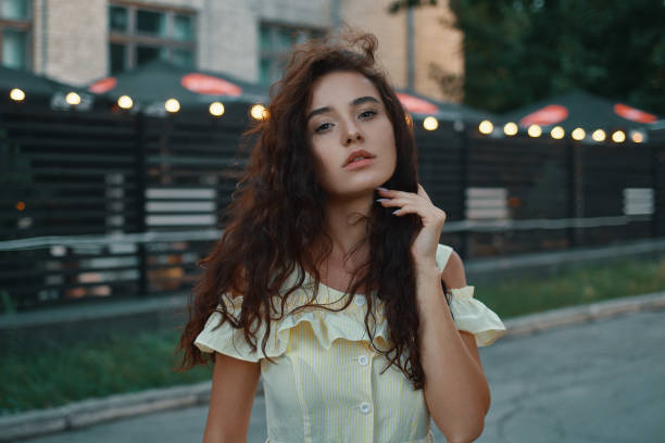 istock Beautiful female face with lights in background 1035744000