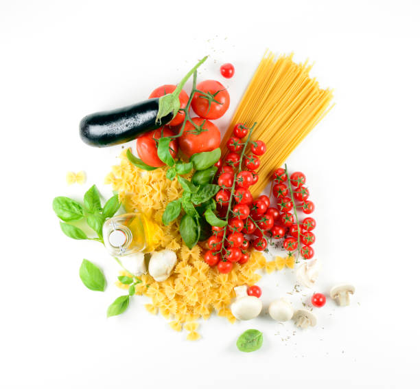 Overhead shot on white background of fresh ingredients for Italian pasta. Fade to white on all four sides.