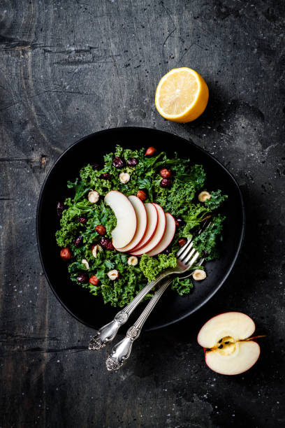 Photo of Kale salad with dried cranberry, hazelnuts and sliced apple