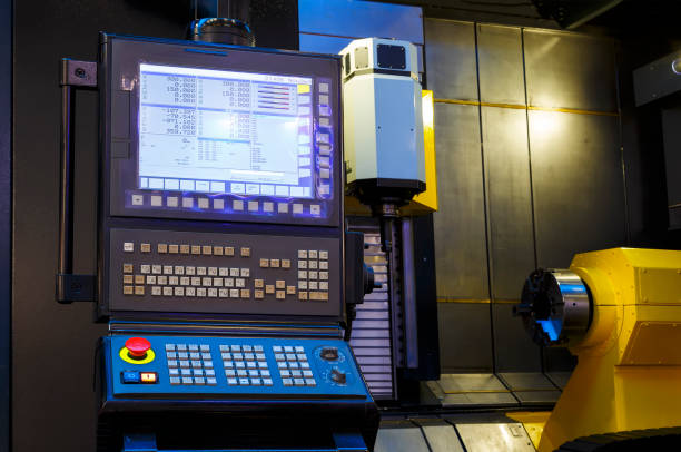 istock modern CNC panel on the background of the open space of the machine, yellow component on a black background 1035751508