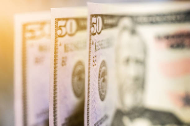 istock 3 banknotes of $ 50 per table 1035751568