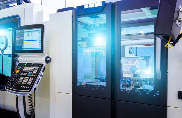 istock Metalworking CNC milling machine. Cutting metal modern processing technology. Small depth of field. Warning - authentic shooting in challenging conditions. A little bit grain and maybe blurred. 1035751770