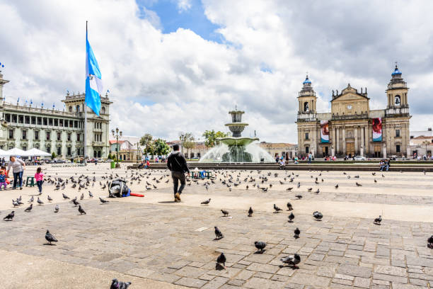 National Palace of Culture & Cathedral of Guatemala City in Plaza de la Constitucion, Guatemala City, Guatemala stock photo