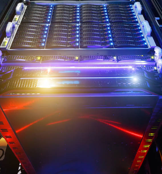 istock Computer Server mount on rack in data center room with red lighting alarm. bottom view on the cluster storage of supercomputer in a data center 1035756372