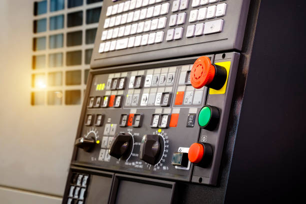 istock Emergency stop button depth of field, focus blur in CNC machine control panel with machining machine and late process 1035757308
