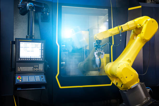 Robot arm motion blur in machine tool metalworking process for industry manufacture,CNC metal machining. stock photo