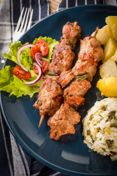 istock Shish kebabs - grilled meat and vegetables 1035761422