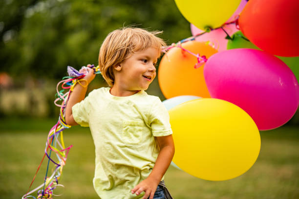 istock Cute little boy with a balloons 1035761890