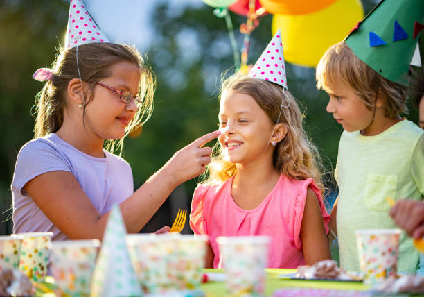 istock children eat cake at a birthday party 1035764648