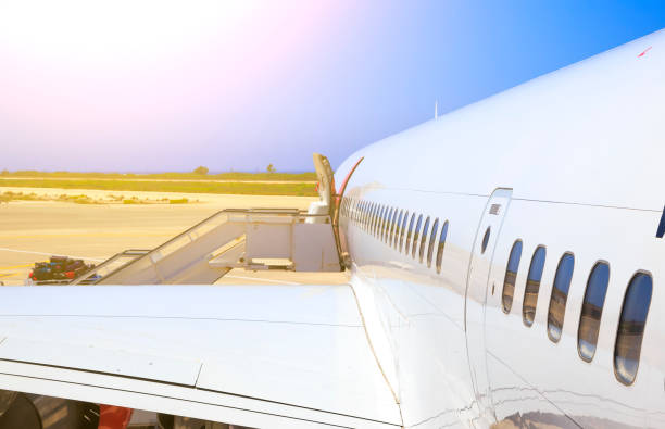 istock large heavy modern passenger widebody airplane side close up detailed exterior view with exit door handle, passenger windows, cargo door, exit lights 1035765418