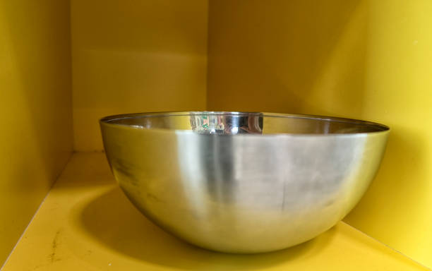 istock Kitchen utensils and tableware on shelf. Group of stainless steel kitchenware. 1035765874
