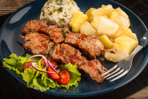 istock Shish kebabs - grilled meat and vegetables 1035766012