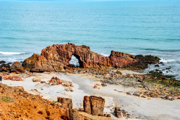 istock Pedra Furada (Holed Stone) at Jericoacoara beach - Ceara, Brazil 1035766082