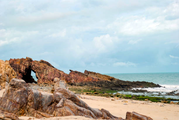 istock Pedra Furada (Holed Stone) at Jericoacoara beach - Ceara, Brazil 1035768944