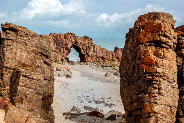 istock Pedra Furada (Holed Stone) at Jericoacoara beach - Ceara, Brazil 1035769036