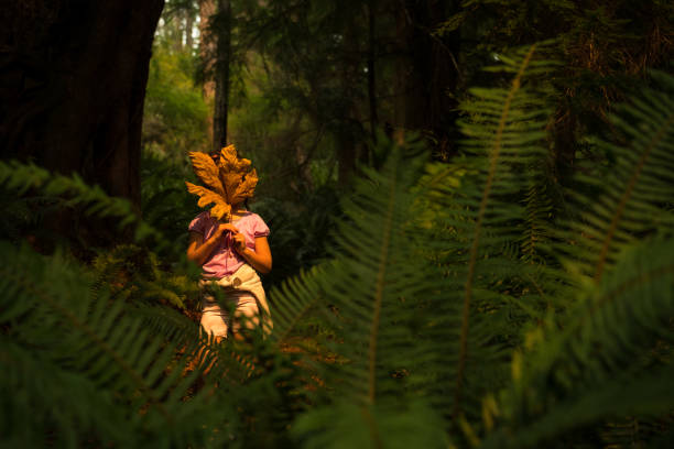 istock Young girl immersed in lush nature 1035777666