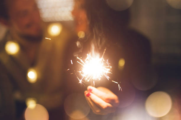 istock Couple with sparklers 1035777804