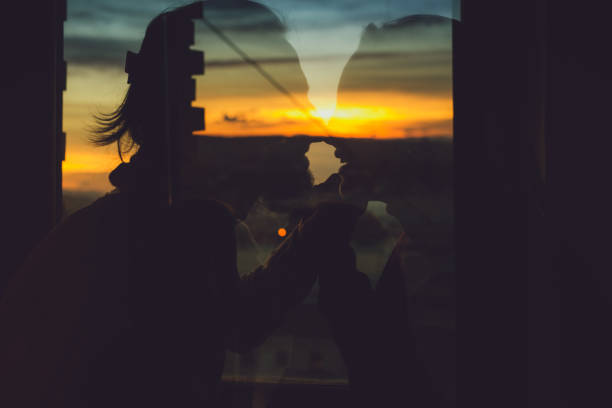 istock Couple kissing at sunset 1035777952