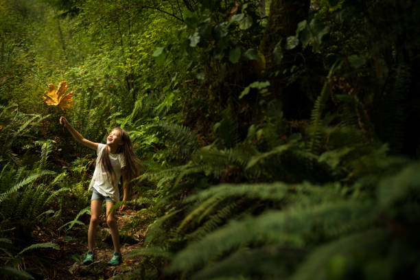 istock Young girl immersed in lush nature 1035777982