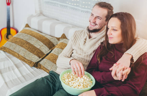 istock Couple watching TV at home 1035778448