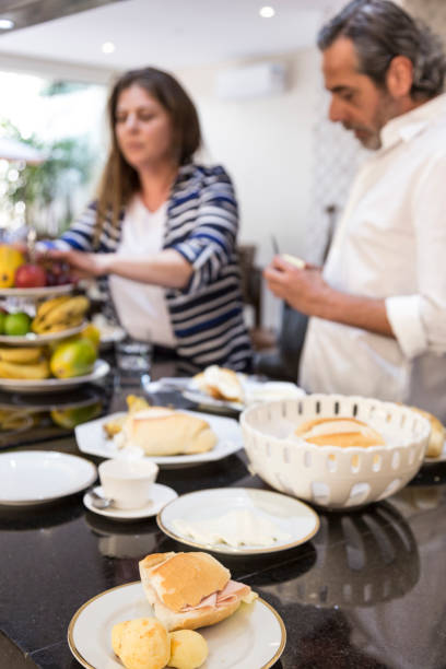 Brazilian family having a traditional breakfast. Concept of a family preparing for the day of work and school.