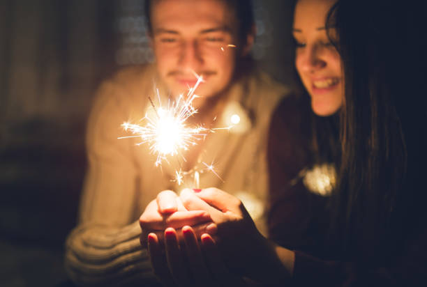 istock Couple with sparklers 1035783194