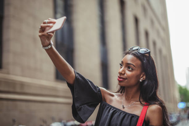istock Beautiful woman taking a selfie 1035785648