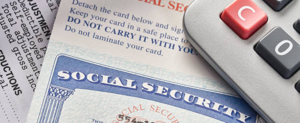 istock Social Security Card on IRS tax document with calculator 1035788356