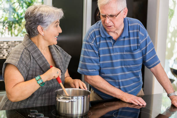 istock Brazilian elderly couple cooking together. 1035788534