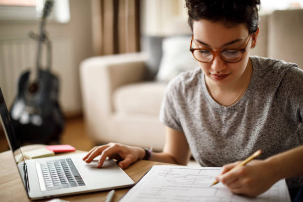 istock Young woman working at home 1035789156