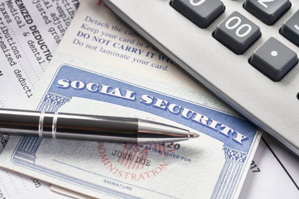 istock Social Security Card on IRS tax document with calculator 1035793414