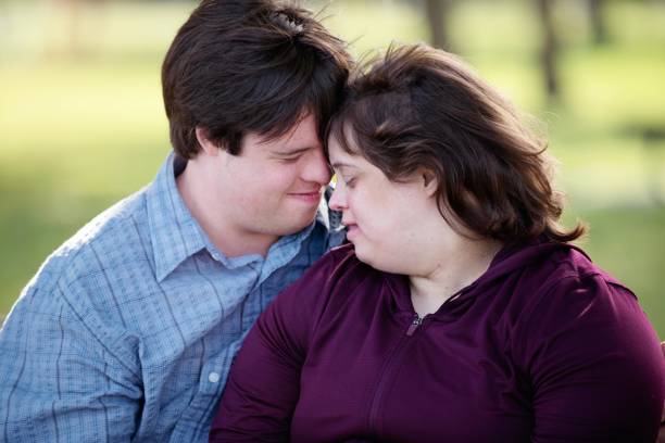istock Couple with Down Syndrome hugging 1035801888