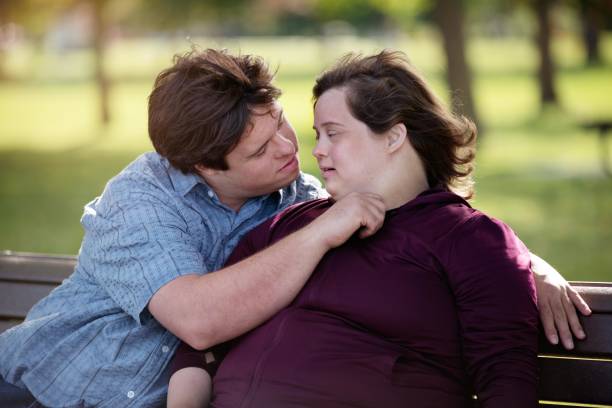 istock Couple with Down Syndrome hugging 1035801896