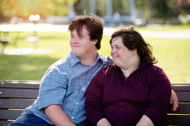 istock Couple with Down Syndrome hugging 1035802110