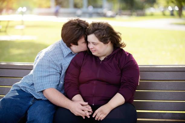 istock Couple with Down Syndrome hugging 1035803920