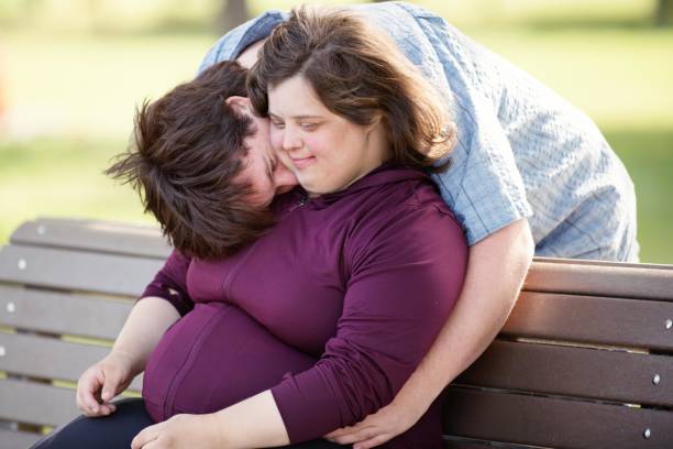 istock Couple with Down Syndrome hugging 1035803932