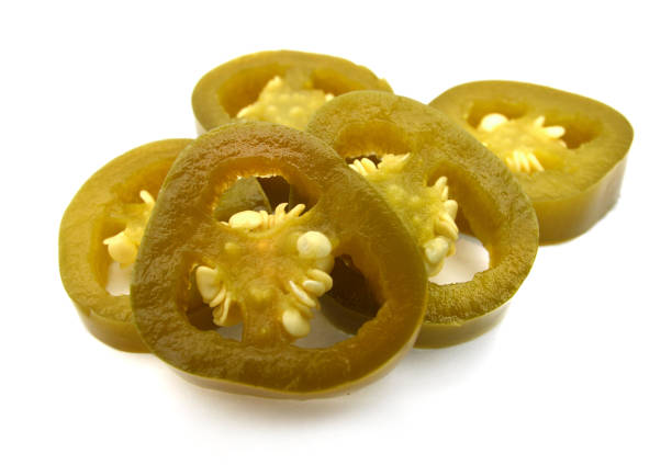 istock Stacking of jalapeno slices on white 1035806826