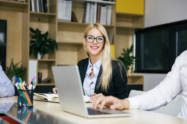 istock Attractive blond businesswoman working in modern office 1035809788