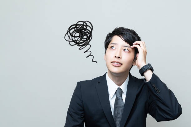 confused young asian businessman. - isolated businessman sadness business person imagens e fotografias de stock