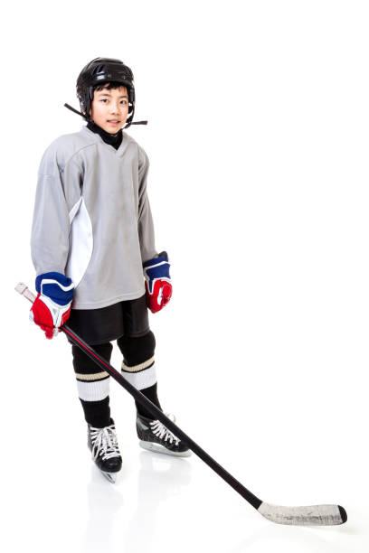istock Junior Boy Ice Hockey Player Isolated on White Background 1035819500