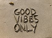 Good Vibes Only Written in Sand