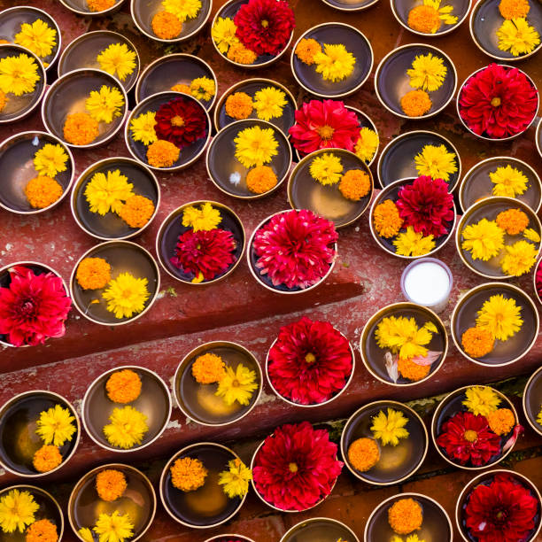 istock Close-up on Buddhist flower offerings in bowls. 1035840568