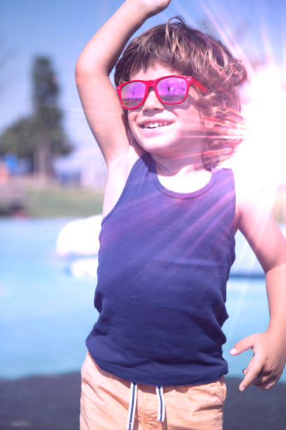 istock Happy little boy plays outdoors jumping on trampoline . 1035840694