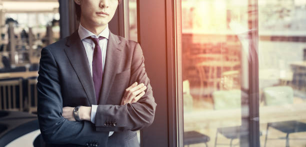 Young asian businessman in office room.