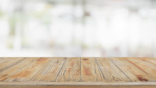 istock Empty wood table top and blurred restaurant interior background - can used for display or montage your products. 1035883996