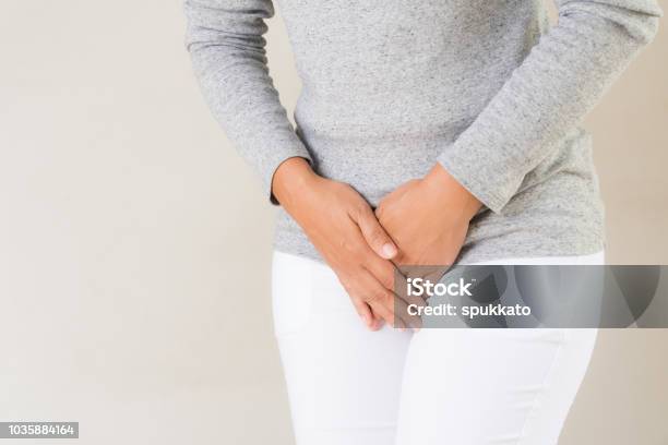 Young Woman Having Painful Stomachache With Hands Holding Pressing Her Crotch Lower Abdomen Medical Or Gynecological Problems Healthcare Concept Stock Photo - Download Image Now