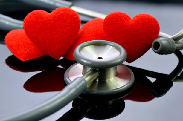 istock Heart and stethoscope on dark background. 1035893038