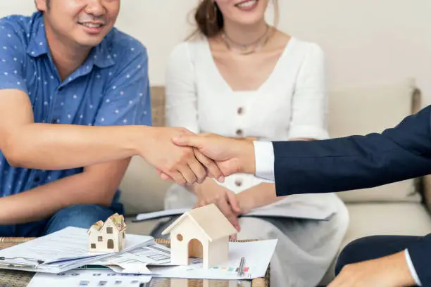 Photo of Close up, Man shaking hands represent sale, Asian couple meeting financial adviser for home, real estate purchase, success business contract deals with sale. Success deals.