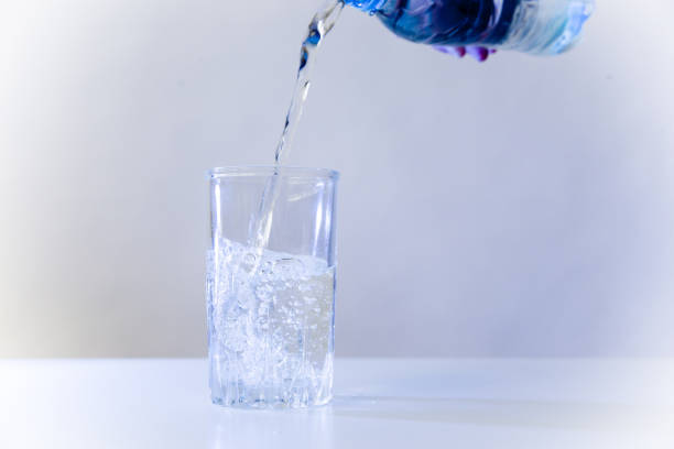 istock Glass of pure water on a white kitchen table 1035905370