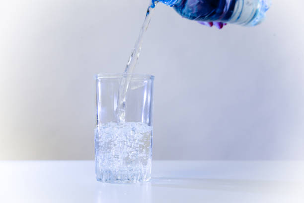 istock Glass of pure water on a white kitchen table 1035905372